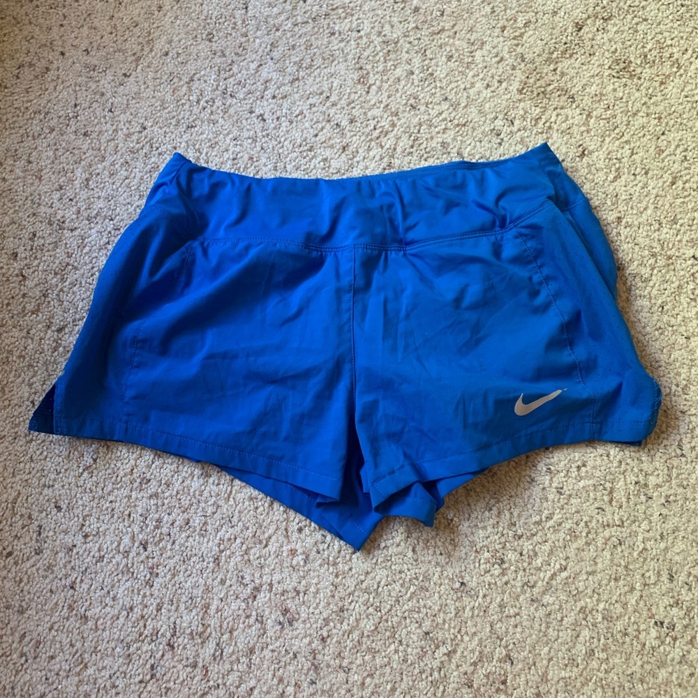 Blue Nike running shorts
